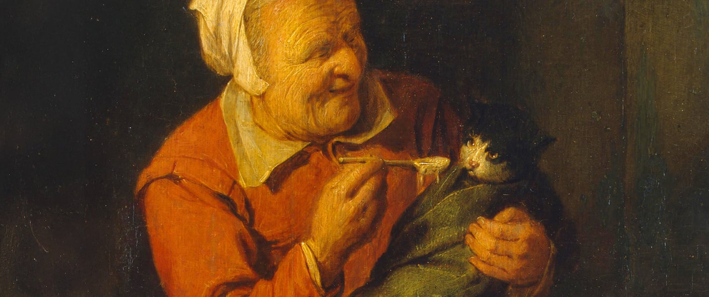 A painting of an old peasant woman feeding a cat with a spoon.