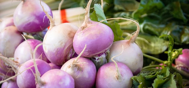 a close up of purple turnips