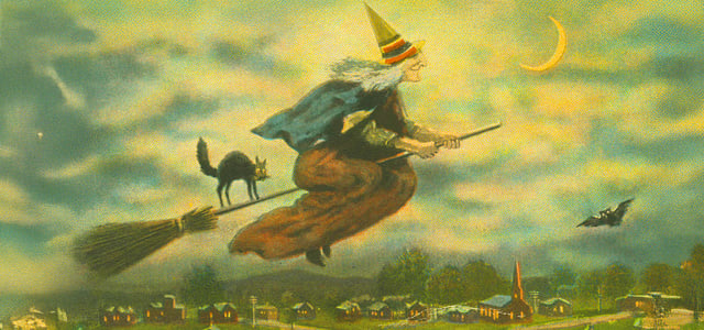 drawing of witch and black cat on a broom