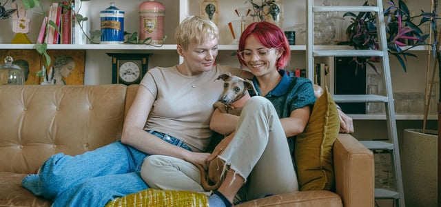 a couple with a dog 