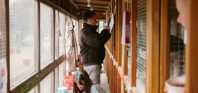A man filling in forms.