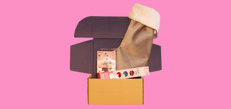 A stocking gift set on a pink background.