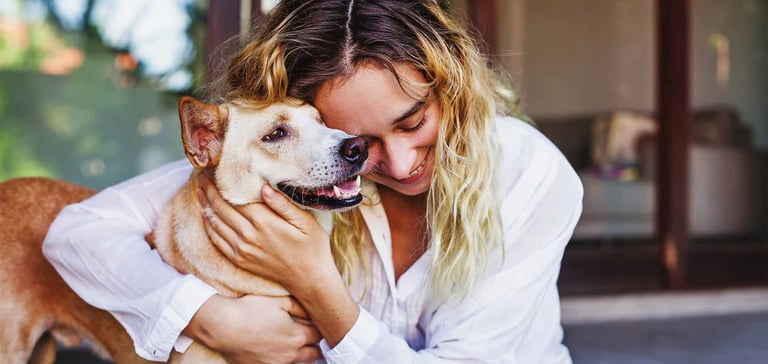 woman holding dog