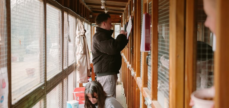 A man filling in forms.