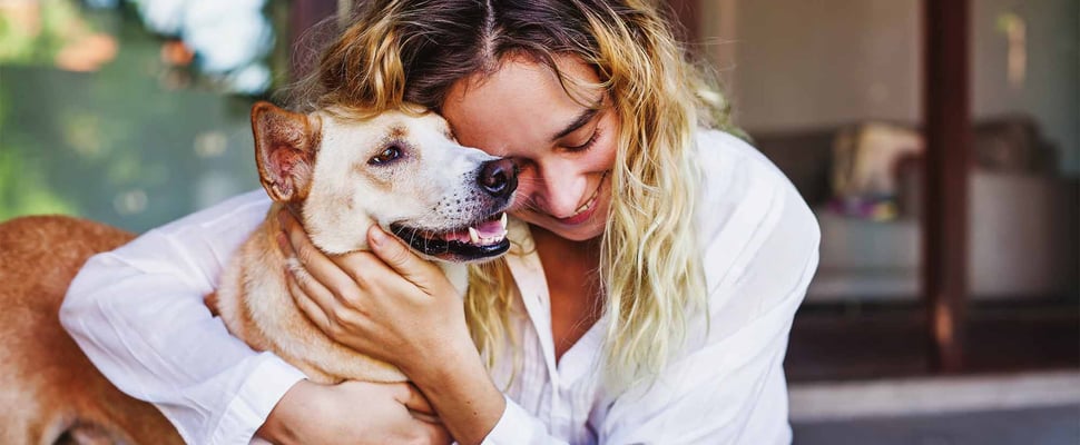 woman holding dog