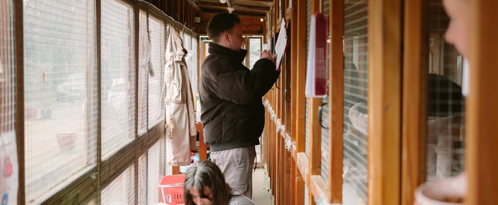 A man filling in forms.